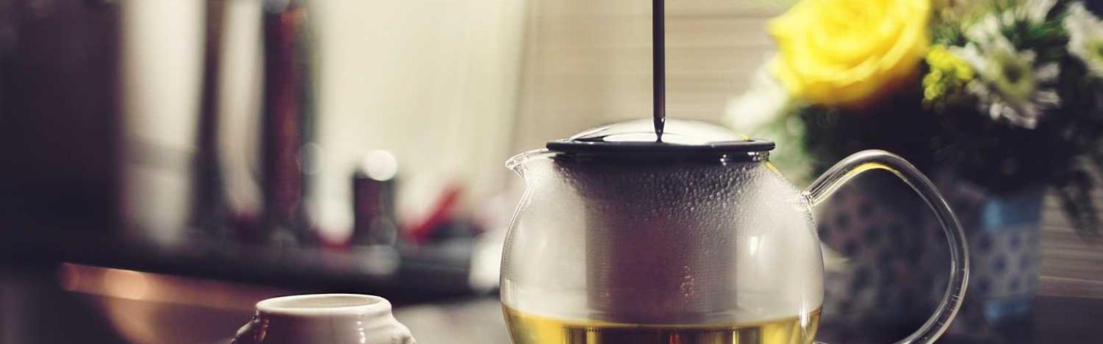 steaming coffee pot, representing friendly, approachable support